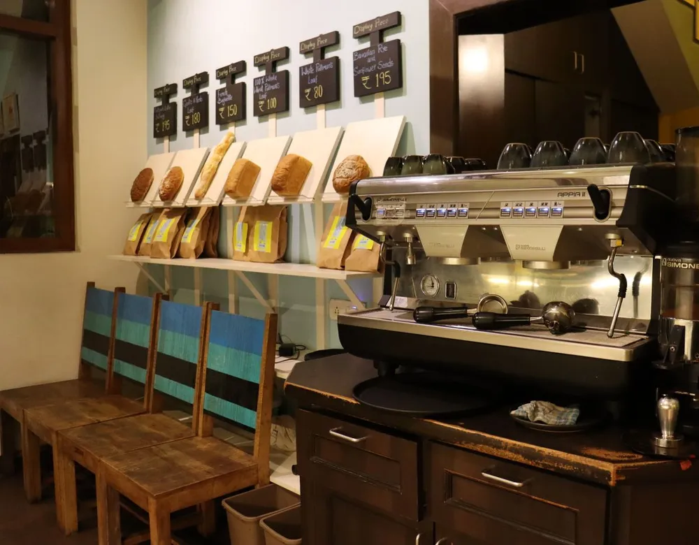 Cafe interior with an espresso machine, a business that relies on pest control