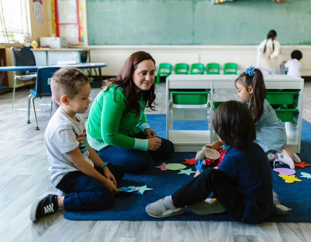 Childcare classroom with children and a teacher