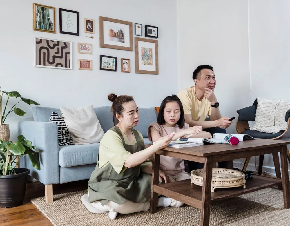 Family enjoying a pest-free living room